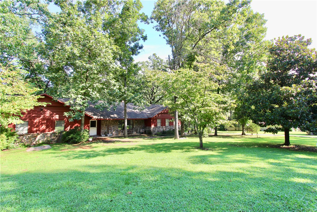 Enjoy a glass of wine, on the deck, watching the deer go by at this spacious home on half an acre close to Beaver Lake and Prairie Creek golf course. Extra wide hallway makes it easy for accessible needs and the extra large family room is a great place to gather. Want a shop? This one is heated and cooled for your working comfort.