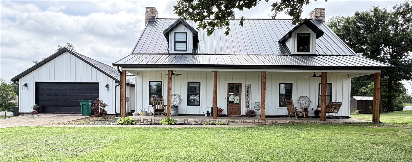 WELCOME HOME! Beautiful farm house on 1.4 acres in Tontitown. Enjoy the perfect blend of space, comfort and convenience in this beautifully designed home on a spacious piece of land. 3 bedrooms, 2 full bathrooms and a half bath, an huge loft/game room upstairs, beautiful sunroom and a 2-car garage. Now board and Barton siding and standing seem metal roof Oct 2025. Spacious primary suite features two walk-in closets, jetted tub and separate tiled shower. The open-concept layout, great for cooking while visiting with guests, creating an inviting space for everyday living and entertaining. The kitchen is equipped with granite countertops, pantry, huge bar and ample workspace. Wood-look LVP flooring extends throughout the living areas, providing durability and style. Front and back covered porches extend the entire length of the home with additional decking walking out to the above ground pool, all overlooking the spacious front and backyards. The perfect home for “country living” right outside of “town”.