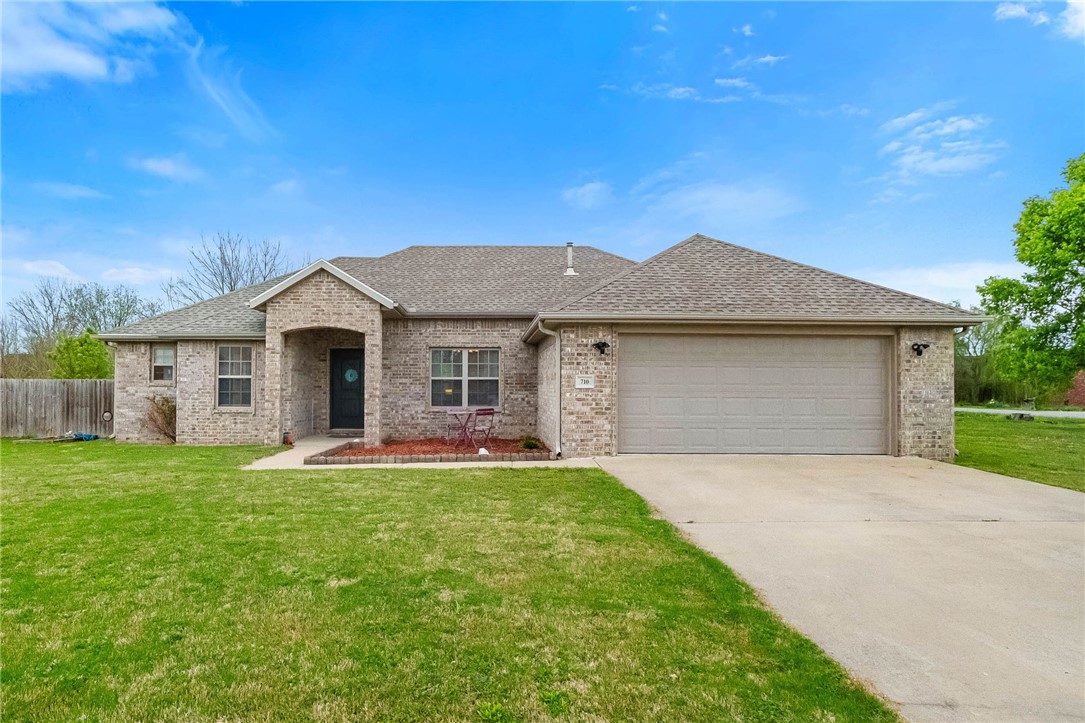 You'll fall in love with this exceptionally maintained, 3BR/2BA, all brick home located in Prairie Grove. This home sits on a huge corner lot, has a fenced back yard, and no HOA! Fence could be expanded to gain additional fenced yard. No carpet in this one! Recently upgraded hard surface floors throughout makes clean up a breeze! Home is very spacious and the raised ceilings in the living room make it feel open and airy. There is a gas log fireplace for cold winter nights. HVAC system is serviced 2x annually by Anderson Air (recent service report available).  The Kitchen features beautiful stainless steel appliance and has a pantry for extra storage. The Primary suite is a nice size with a tray ceiling and walk-in closet. The primary bath has double sinks, walk-in shower, and jetted tub. Sidewalks run throughout the subdivision, making it a great area for walking. Close to Prairie Grove’s waterpark, historic downtown, restaurants, flea markets, schools, and parks.