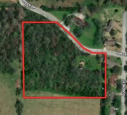 A rare opportunity to purchase 7.32 acres of virgin timber land located inside the city limits of Harrison.  Giving you all the comforts and conveniences of the City and the feel of the Ozarks county.  Paved road frontage, city utilities, and walking distance to the High School.  A beautiful setting for a dream home or divide and develop.  Lots of options with this property.