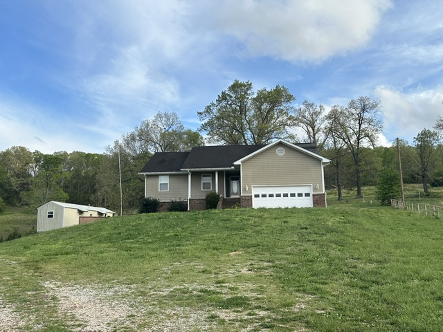 Country living at its finest!  This stunning +/- 23-acre property offers the perfect blend of open space, comfort, and versatility. With approximately 19.6 acres of cleared, usable land, the opportunities are endless—ideal for farming, livestock, recreation, or simply enjoying wide-open views.
The main home features 3 spacious bedrooms, a dedicated office, 3 full bathrooms, providing plenty of room for family and guests. A basement adds more flexibility, whether you need storage, a hobby space, or future expansion.Step outside - take in the beautiful, scenic surroundings that make this property special. A separate guest house adds tremendous value—perfect for visitors, rental income, or multi-generational living. Additional highlights include: A pond, propane-powered generator for peace of mind. Tankless hot water heater, 24x30 pole barn, ideal for storage, or workshop use.  Whether you're seeking a peaceful retreat, a working homestead, or a place with room to grow, this one is a must-see.