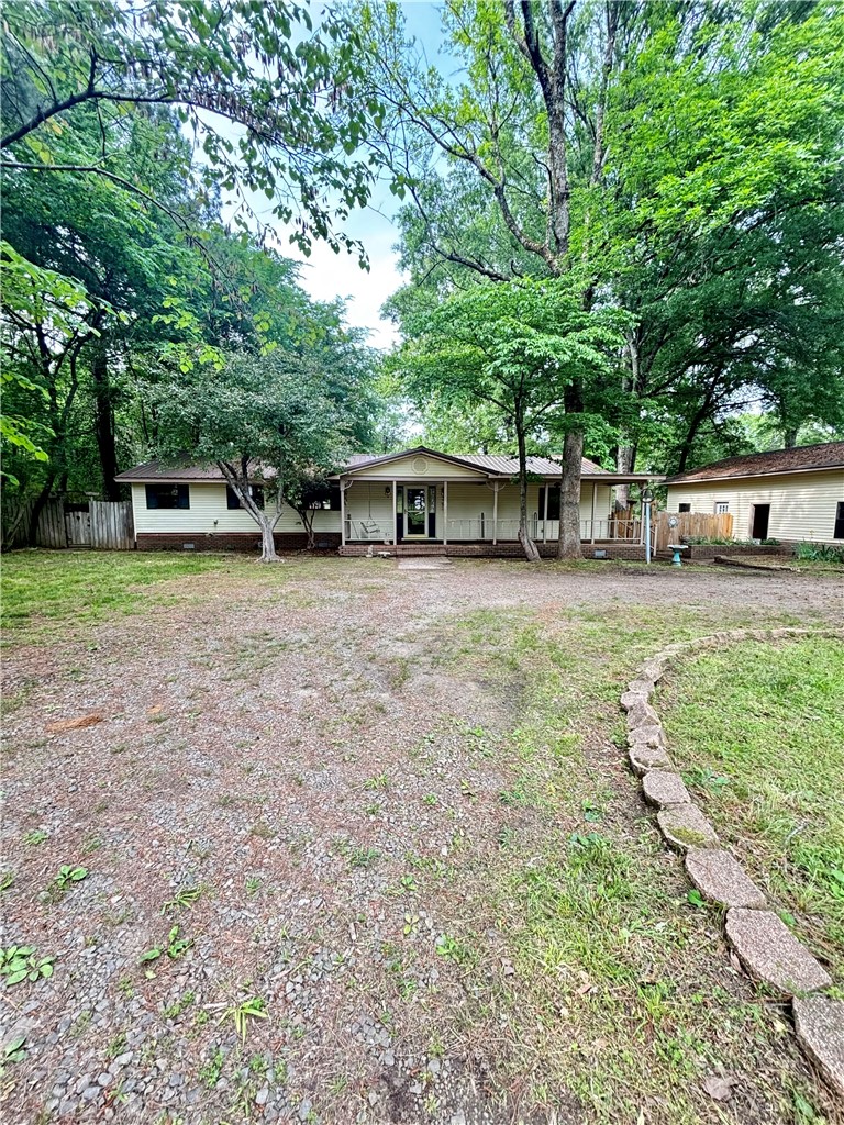 Welcome to this 3-bedroom, 2 bath home offering 1,954 sq ft on 2.28 acres. Enjoy peaceful country living with a pool and stocked pond, plus a garage and separate shop for projects or storage. An outdoor half bath adds extra convenience for guests and poolside enjoyment.