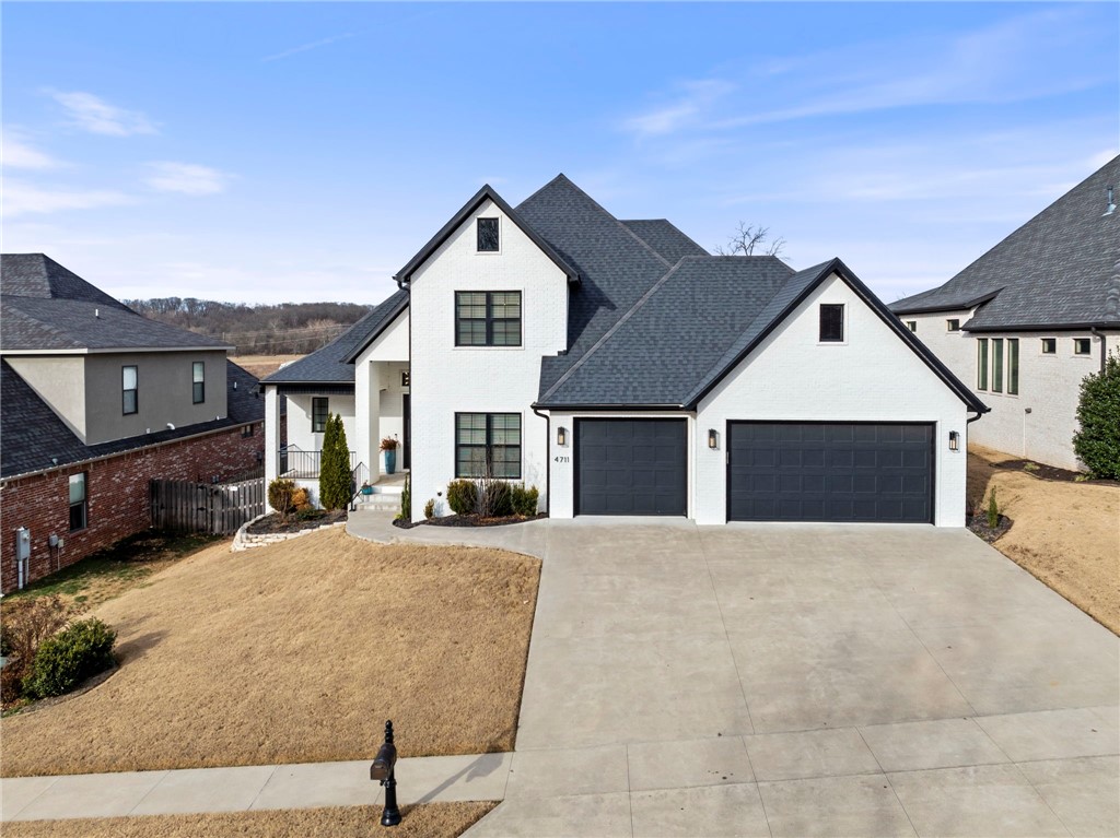 Get ready for this one in Shadow Valley that just hit the market! Prime Location in highly sought out country club close to all things entertainment in Northwest Arkansas. This home checks all the boxes and is priced just right. Current owner is using this as a 5 bedroom but could also be used as a 3 bedroom plus an office plus a bonus room.  Clean aesthetic with modern custom finishes throughout. Features gorgeous floor to ceiling fireplace, designer lighting, custom cabinetry, and quartz countertops. The open kitchen features a gas range, double ovens, large walk-in pantry, and oversized island.  Enjoy 8-ft doors, tankless hot water, large utility/mudroom, 3-car garage, and two walk-in attics. Covered concrete front and back patio areas plus a yard that is pool-ready if you desire. Bentonville Schools makes this one even more desirable! Schedule your showing today before it's gone!