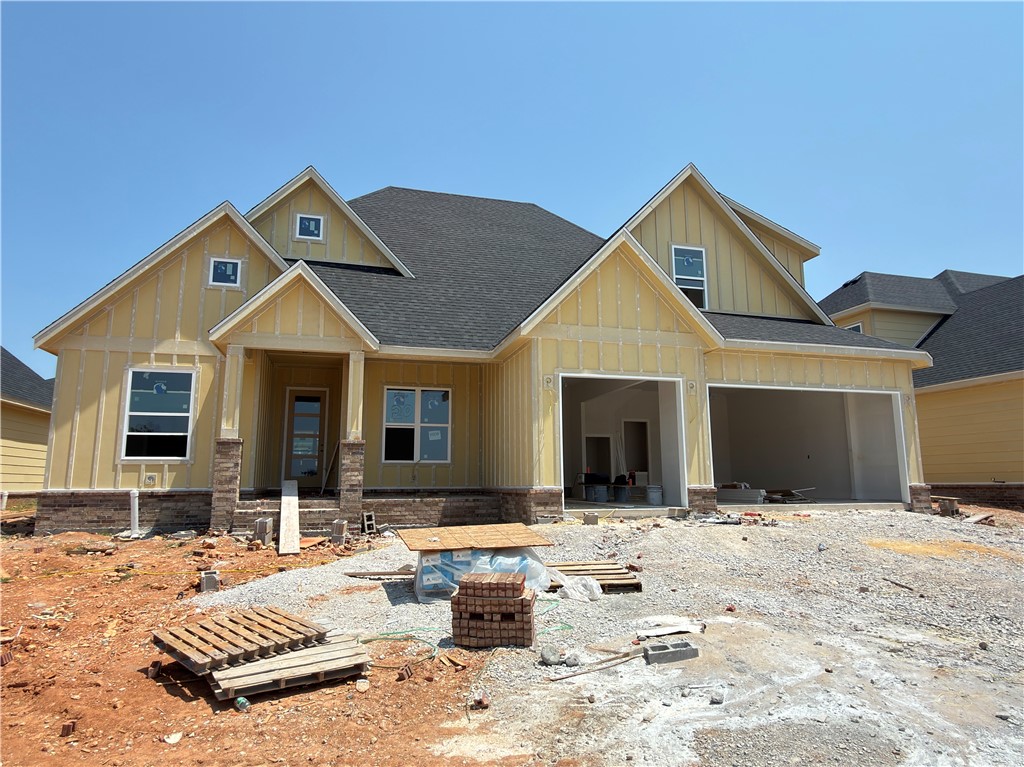 The Hunter Plan is one of our most favored floor plans, offering 4 bedrooms, 3 full bathrooms, a dedicated office, bonus room, and exceptional built-ins throughout. The open-concept main level features a spacious living room with custom shelving surrounding the fireplace, flowing into a designer kitchen with a large island featuring a one-sided waterfall edge, gas cooktop, built-in oven and microwave, walk-in pantry, and dining area with access to the covered back patio. The private primary suite offers an oversized dual-sink vanity, linen closet, soaking tub, walk-in shower, and an expansive walk-in closet complete with abundant shelving, built-in dresser, and direct access to the laundry room. Upstairs you'll find bedrooms 3 and 4, a full bathroom, and a versatile bonus room. Ideally located across from a top-ranked elementary school and just down the street from Mt. Hebron Park, XNA, shopping, dining, and entertainment.