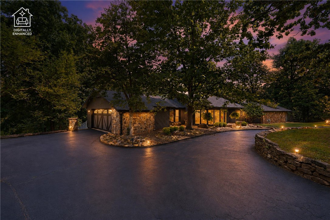 Spectacular John Newland Home in Hyland Park. Situated on 2.03 acres, this home has a unique style all its own. The single level California contemporary is 2717 square feet with 3 bedrooms and 2 bathrooms and attached 2 car garage. Relax and keep warm in front of the curved stone fireplace in the winter or sit with a book in the natural light from the panoramic floor to ceiling windows in the formal living room. Modern chefs’ kitchen with stainless steel appliances and granite counter tops for efficient meal prep. Wet bar area leading to the rear deck for entertaining and outdoor enjoyment. Master bedroom with large walk-in closet, private deck and spa inspired ensuite. From the slipper tub and the glass shower to the sauna right outside in a private piece of Zen, this bathroom is truly therapeutic. Large fenced backyard and plenty of gorgeous trees. Enjoy Lake Atalanta, Beaver Lake and all that Northwest Arkansas have to offer from this one-of-a-kind home in this sought-after community east of downtown Rogers.