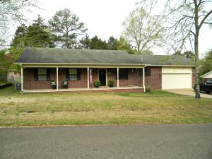 This super cute 3 bedroom 2 full bath home is priced to sell! Enjoy the spacious open floor plan and large kitchen with lovely oak cabinets and ample counter space. Beautiful laminate and vinyl plank flooring throughout. You will absolutely love the deck and large fenced back yard complete with a storage building with loft storage. Enjoy in-town living  with some elbow room and privacy. Don't miss seeing this one.