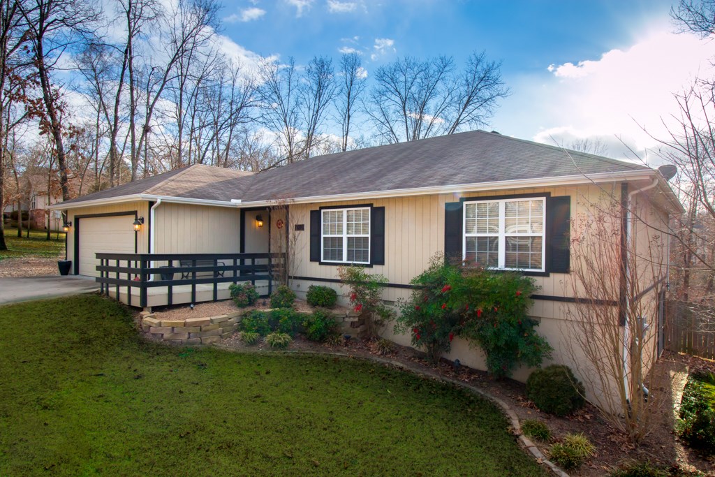 This cozy home offers all the natural charm of the Ozarks, while still conveniently close to all the amenities of life. Lovingly maintained and cared for. From the spacious interior and generous rooms, to the open Kitchen, Dining, and Living rooms, this lovely home is Arkansas living at its best. Imagine yourself enjoying a gorgeous Sunset from the huge, full length back Deck.  The landscaped, gently sloping backyard meets the Greenbelt for natural privacy.  You are buying a lifestyle, not just a home!