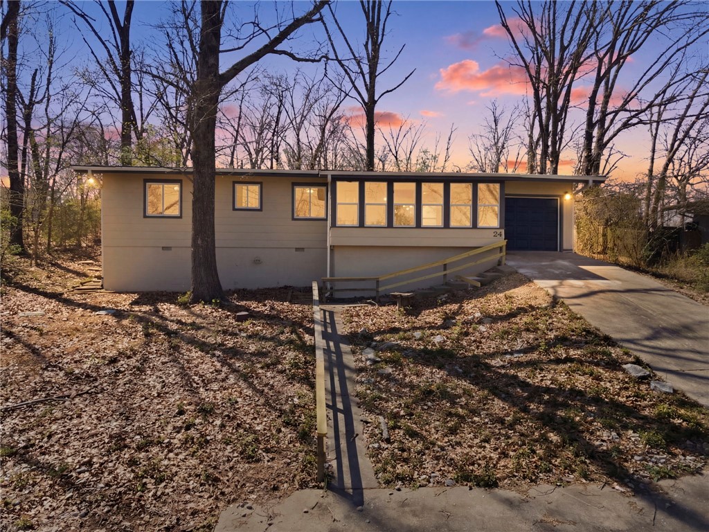 Fully remodeled and move-in ready, this 3-bedroom, 2-bathroom Bella Vista gem delivers the complete package — stunning lake views, trail access, and a top-to-bottom renovation. A sun-drenched sunroom off the front captures breathtaking views of Lake Avalon, creating the perfect spot to start your mornings. Inside, the brand-new kitchen shines with all-new cabinetry, quartz countertops, and a full appliance package including range, vent hood, dishwasher, microwave, and garbage disposal. New LVP and ceramic tile floors flow throughout, complemented by fresh interior paint, a new lighting package, updated plumbing fixtures, and new double-pane vinyl windows. Both bathrooms have been fully remodeled. New HVAC keeps comfort year-round. Walk to Lake Avalon or hop on the Lago Vista Spur bike trail right at the top of the road — plus easy access to all Bella Vista POA amenities.