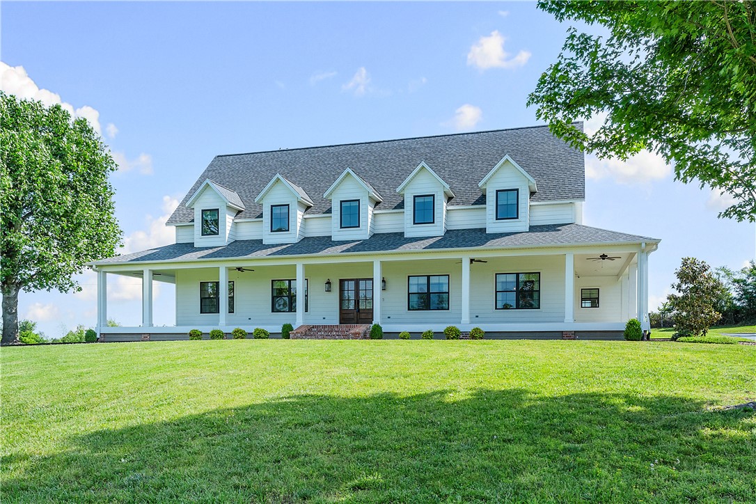 Exceptional fully remodeled estate situated on 5.01 unrestricted acres in one of Rogers’ most desirable locations, just minutes from Pinnacle Hills, the Promenade, dining, entertainment, and I-49. Properties offering this level of acreage and convenience are increasingly rare in Northwest Arkansas.

This stunning 5-bedroom, 4-bath residence has been thoughtfully reimagined with elevated design and timeless style throughout. Features include maple floors, stone pebble showers, clawfoot tubs, a state-of-the-art kitchen, spacious living areas, and an inviting wraparound porch that blends luxury with everyday comfort.

Outdoor amenities include a remodeled pool, updated pool pump room, expansive open land with endless possibilities, and a new roof. Extensive updates throughout provide modern functionality and peace of mind.

With no neighborhood restrictions, this turnkey luxury estate offers exceptional flexibility and convenience in an unmatched Northwest Arkansas location. A must see.