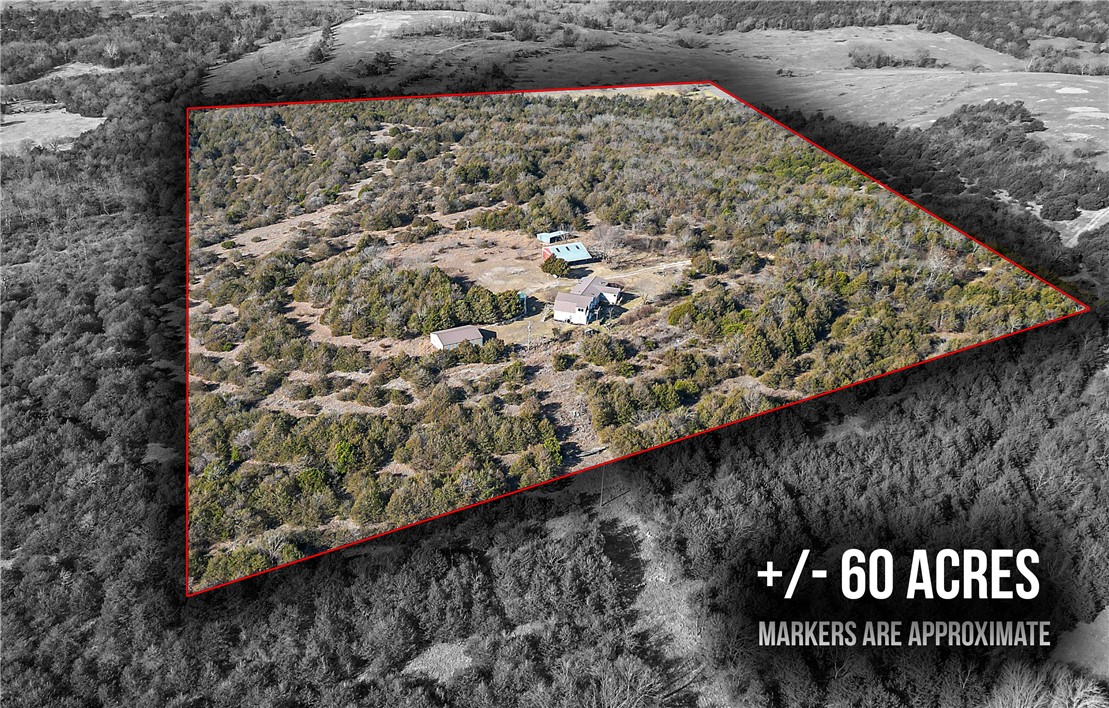 Perched high in the Ozark Mountains, this breathtaking mountaintop retreat offers panoramic views in every direction and over 59 acres of privacy and beauty. The expansive 3,424 sq. ft. two-story home features a bright sunroom, a spacious master suite with an oversized walk-in closet, and a luxurious master bath complete with a walk-in soaking tub. A unique blend of 1,620 sq. ft. of double-wide construction and 1,804 sq. ft. of conventional living space provides room to spread out and entertain. The property includes two 30x40 shop buildings with concrete floors, one with a 12x40 lean-to, perfect for hobbies, storage, or equipment. Enjoy the peace of seclusion while staying conveniently close to town—less than 30 minutes to Branson and under 20 minutes to Table Rock Lake. With new roof shingles installed December 2024, this remarkable property is move-in ready and ideal for those seeking space, views, and the ultimate Ozark lifestyle.