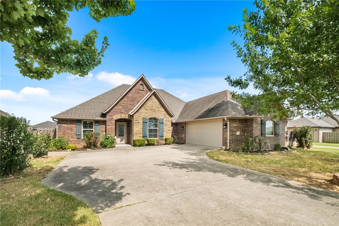 Enjoy the Bentonville lifestyle in this spacious 4-bedroom, 3-bath home offering 2,268 square feet in a fantastic location! The bright, open layout brings the kitchen, dining, and living areas together, making it perfect for entertaining or everyday living.The kitchen features granite countertops, generous workspace, and plenty of cabinetry. A flexible bedroom layout gives you room for guests, a home office, or hobbies, while the private primary suite offers a relaxing retreat. Step outside to a fenced backyard and covered patio ready for grilling, entertaining, or unwinding. Located less than a mile from Elm Tree Elementary and Ardis Ann Middle School, approximately 2 miles from Coler Mountain Bike Preserve, and a short bike ride to the future 8th Street Gateway Park. Bike the trails, visit Crystal Bridges, enjoy dinner on the Square, or explore downtown, all just minutes from the Walmart Home Office and only 10 minutes from Bentonville Square! More outdoor fun is coming when 8th Street Gateway Park opens in 2026!