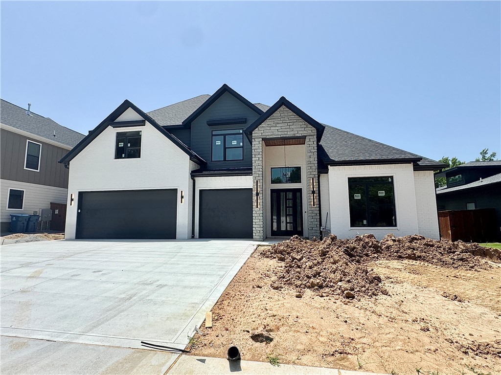 Located in the perfect location w/ easy access to Coler Mountain Bike Preserve trails, schools, downtown Bentonville & more. The heart of this haven is undoubtedly the chef's kitchen, sprawling island, vegetable sink, 5-burner/double oven gas range, quartz counters, walk in pantry, and custom stained exposed beams. Living room centers around stunning tile gas fireplace, enveloped by oversized windows that bathe the space in light and soring 2 story ceiling with track lighting. Retreat to the primary suite, where oversized windows invite in sunlight & spa-inspired bath with a walk-in tile shower featuring double showerheads, soaking tub, double sinks, smart mirrors & walk-in closet with pull down rods. Secondary bedroom on the main level with wood floors, custom beams and accent wall would also be the perfect study. Upstairs reveals a generous bonus room with a wet bar and three secondary bedrooms. Enjoy the oversized covered patio overlooking the fenced backyard. $3,000 if you use the preferred Lenders