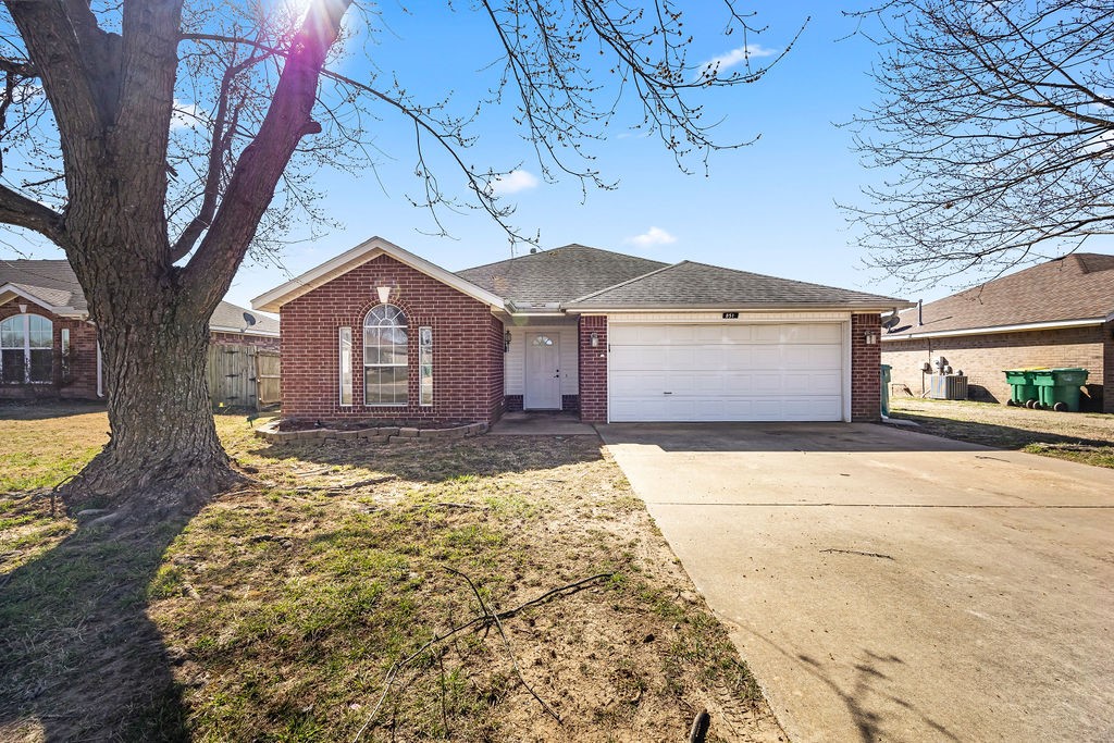 Beautiful 3-bedroom, 2-bath, 2-car garage home in a great location! Available now! This all-brick home features tile flooring throughout the hallway, living room, kitchen, and bathrooms, with laminate flooring in all bedrooms. The kitchen comes equipped with an electric range, dishwasher, and refrigerator. The spacious primary suite includes a private bathroom with a double-sink vanity, two separate walk-in closets, and a tiled shower. Enjoy the privacy-fenced backyard with a storage shed, perfect for extra storage and outdoor enjoyment. Conveniently located just minutes from Bentonville West High School. An online application is required. One pet is allowed with a $300 non-refundable pet deposit and $30/month pet rent. Call today to schedule your private tour!