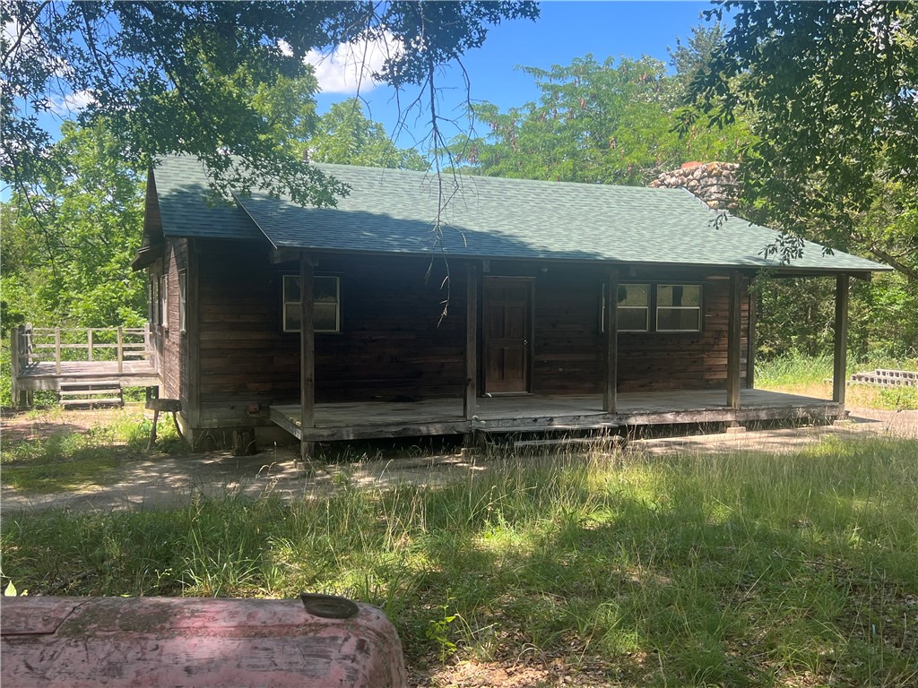 This remarkable property offers substantial acreage along the Kings River, with accessible riverbank frontage, mature timber, and unmatched privacy—balanced by just the right touch of open meadow. Less than two miles from pavement, down a well-maintained county road, the setting feels worlds away.

A cabin with electricity and a well is already in place, making it easy to settle into your secluded valley. The winding driveway leads you beneath towering hardwoods, creating a natural entrance that immerses you in peace and solitude.

Spanning approximately 200 acres, the land is protected by a conservation easement, ensuring its natural character and beauty are preserved for generations. This stewardship not only enhances the property’s appeal but also safeguards the surrounding environment. Adding to the sense of seclusion, more than two miles of the property’s boundary adjoins holdings of The Nature Conservancy.