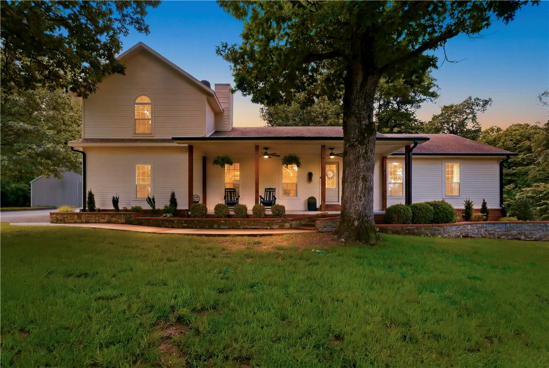 Welcome to your own private slice of NWA. Nestled on 17 picturesque acres with breathtaking views and complete privacy, this beautifully updated farmhouse offers the perfect blend of peaceful country living and convenience to town. A gated drive welcomes you home, where you'll find a move in ready, updated home still full of character and charm. 
Enjoy summer days by the pool featuring fully resurfaced decking and a new automatic cover, or relax by the stocked, aerated pond. The property includes a 900 sq. ft. heated/ cooled shop, a barn, and fenced pasture ideal for livestock, recreation, or future development potential. 3 acres of pasture is currently leased to a neighboring equestrian center for $850/month, providing immediate income opportunity.
Whether you're looking for a hobby farm, investment potential, or simply room to breathe - this one-of-a-kind retreat offers endless possibilities with the privacy and beauty you've been searching for.