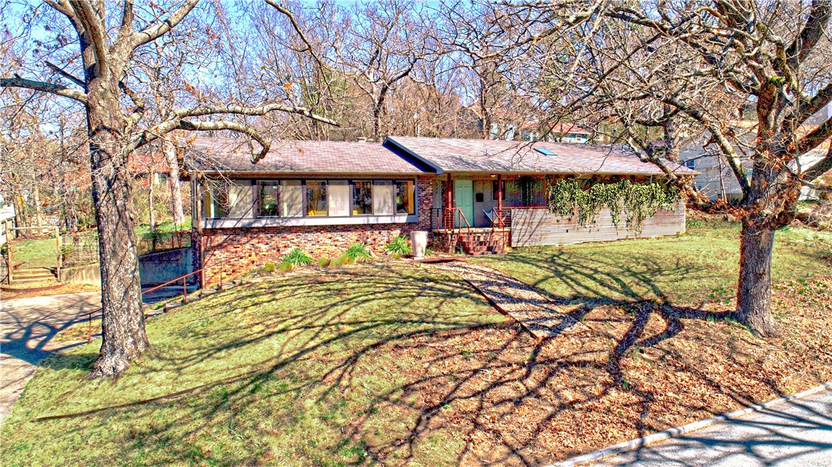 What a rare find in the Wilson Park area! This beautiful mid-century modern home was custom built in 1965, has only had two-owners & is eagerly awaiting the new owners!  It has been meticulously maintained & updated so is move-in ready.  Home features an expanse of windows facing the park & a beautiful wooden display area just ready to exhibit some art pieces or plants. Custom wood open cabinetry separates the living, dining & den areas.  Cozy, well-appointed kitchen with gas range.  Three bedrooms & two baths.  Owners suite is spacious, w/updated bathroom & closet with built-in’s.  Wood floors with tile in bathrooms.  Two-car garage with storage rooms.  Great deck overlooking tree-shaded backyard with a bioswale.  Extra lot at the back of the property can be split off with buyer having right of first refusal.  Don’t miss this opportunity to own a piece of Wilson Park history!
