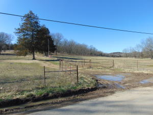 Nice cattle farm fenced and cross fenced. Bermuda grass hay fields. Currently 30 head of mother cows year round and an average of 200 bales of hay per year.  2 ponds plus several streams. Highway frontage. A barn. Lots of turkey and deer and current cattle crop can be purchased for an additional amount
