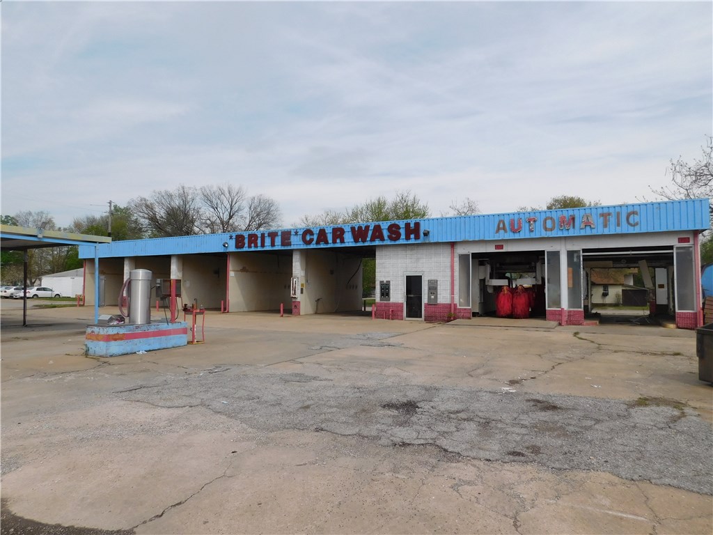 2 parcels that includes car wash and empty lot next door. Totaling in 1.18 Acres. Great location for car wash, auto repair or new business. Zoned C-2. All utilities at street. 24,000CPD. Easy access to I-49 and Hwy 71. Near many restaurants and offices.