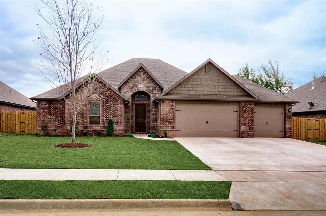 Come check out this stunning home located in Bentonville, AR! This home comes with a 3 car garage, fireplace, spacious kitchen, granite counter tops, walk-in closets, covered patio with outdoor fireplace and so much more!