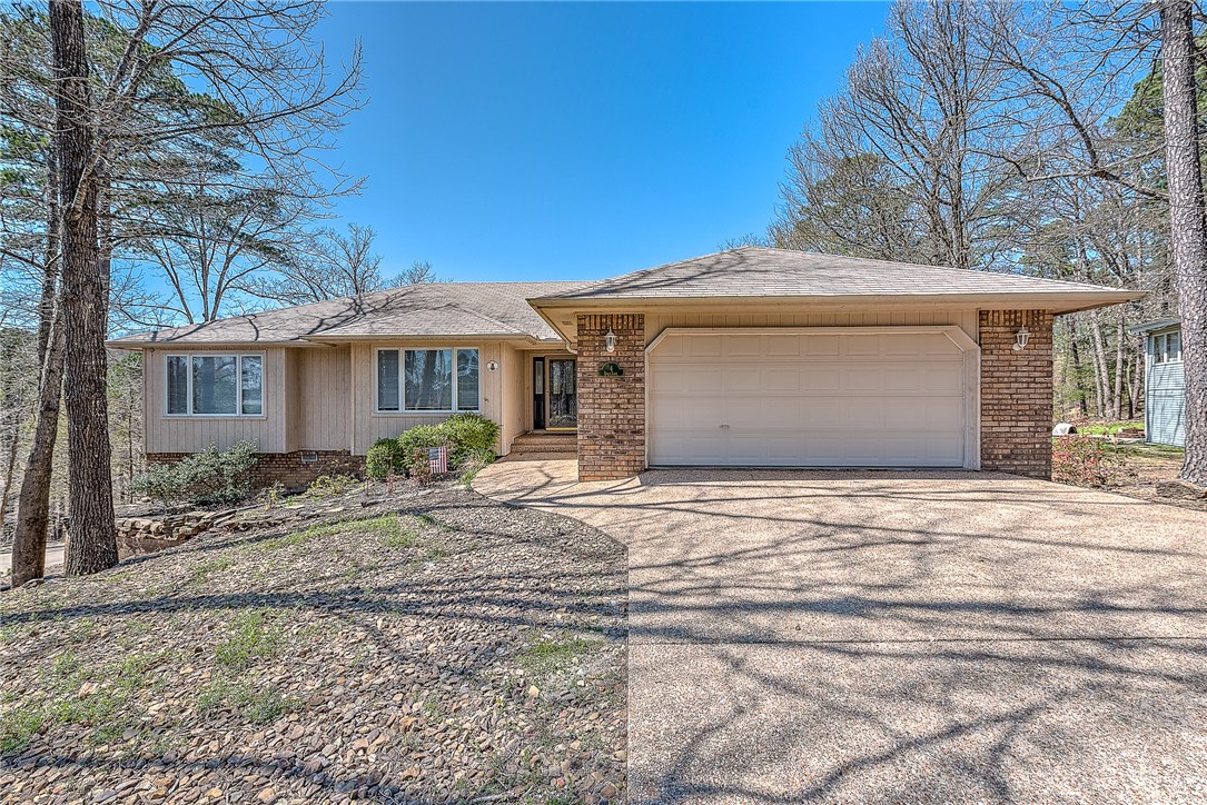 Come home to Bella Vista. With lots of room to expand; this home would be a great one for your family. Bentonville schools, Parks and Trails nearby and easy access to main road. Very well built and insulated. Covered back deck overlooking common property that goes down to Lake Rayburn. Bright white kitchen, updated fixutres in the master bath. Very quiet cul de sac lot and established neighborhood. Heated and cooled bonus room/workshop in basement with additional storage.