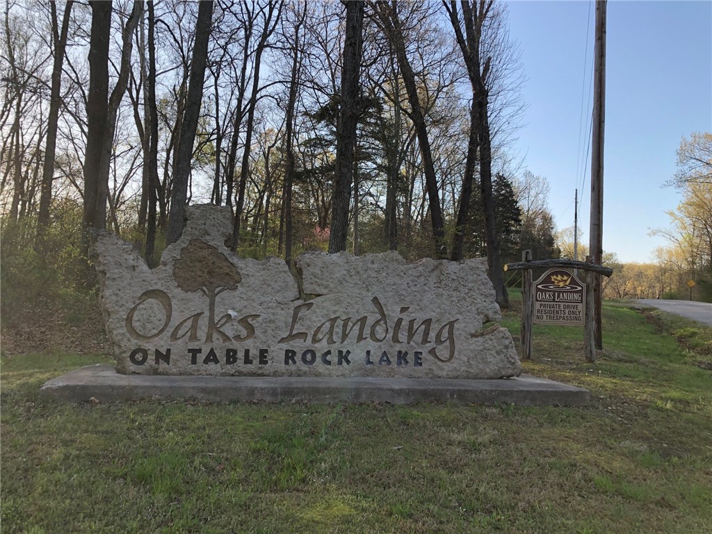 Oaks Landing on Table Rock Lake provides a beautiful secluded 45 lot acreage subdivision nestled between Table Rock Lake and the Mark Twain National Forest. A paved private road leads to this fantastic 3-acre lot that gently slopes down to a bluff with approximately 200' of lake front. The terrain includes rock outcrops and dense lush vegetation providing many great locations for building your custom dream home. Imagine looking out your window and seeing the magnificent sparkling Table Rock Lake waters and beautiful Ozark Mountains.
A private subdivision owned swim/fishing dock provides for easy lake access and enjoyment. 
The mature hardwood on this lot will amaze you with autumn colors and spring blooms. Nature and adventure surround you in Oaks Landing but if you want to venture out you are only 30 minutes from Downtown Eureka Springs and less than an hour from Branson or Rogers/Bentonville. This property is a must see!