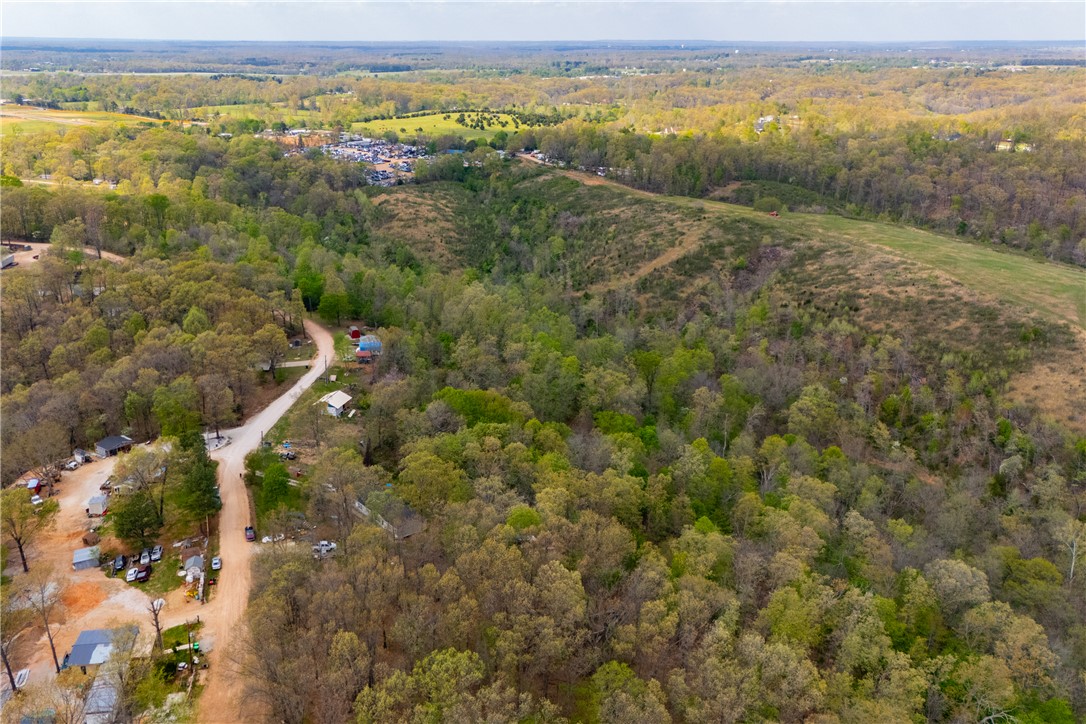 Exceptional development opportunity with this expansive parcel offering endless potential. Ideally positioned for future growth, this property provides a prime setting for residential, investment, or mixed-use development. There's a mobile home with ample space to bring your vision to life, the land features a desirable location that balances accessibility and privacy. Whether you're looking to build, subdivide, or hold for future appreciation, this property presents a rare chance to capitalize on a high-potential investment. Utilities nearby (verify with local providers). Don’t miss this opportunity to secure a versatile tract in a rapidly growing area.