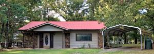 LAKE FRONT home with wonderful view of the water from the peaceful deck or sunroom.  Enjoy your weekends fishing or just live at the lake year round.  Call today for your tour of the property!