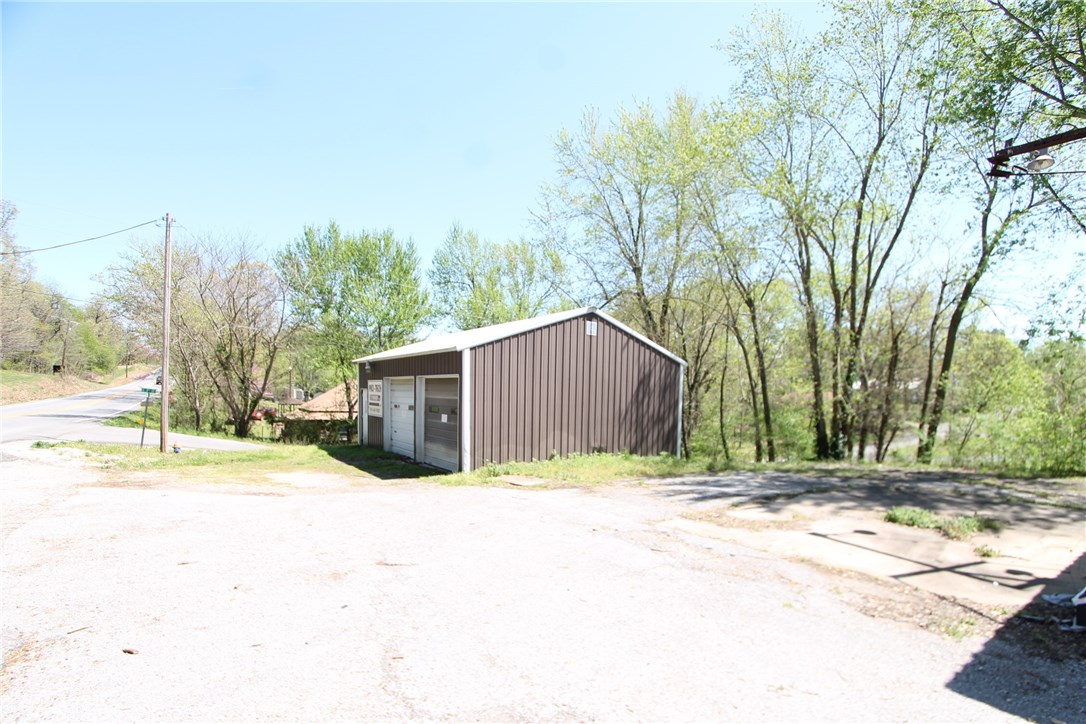 Corner Lot in grown Cave Springs Area. There are some old structures on this lot of no value Zoned C3.  Property is to be Sold as is.  There is a shop building that could still be used.  Call Sean for more details