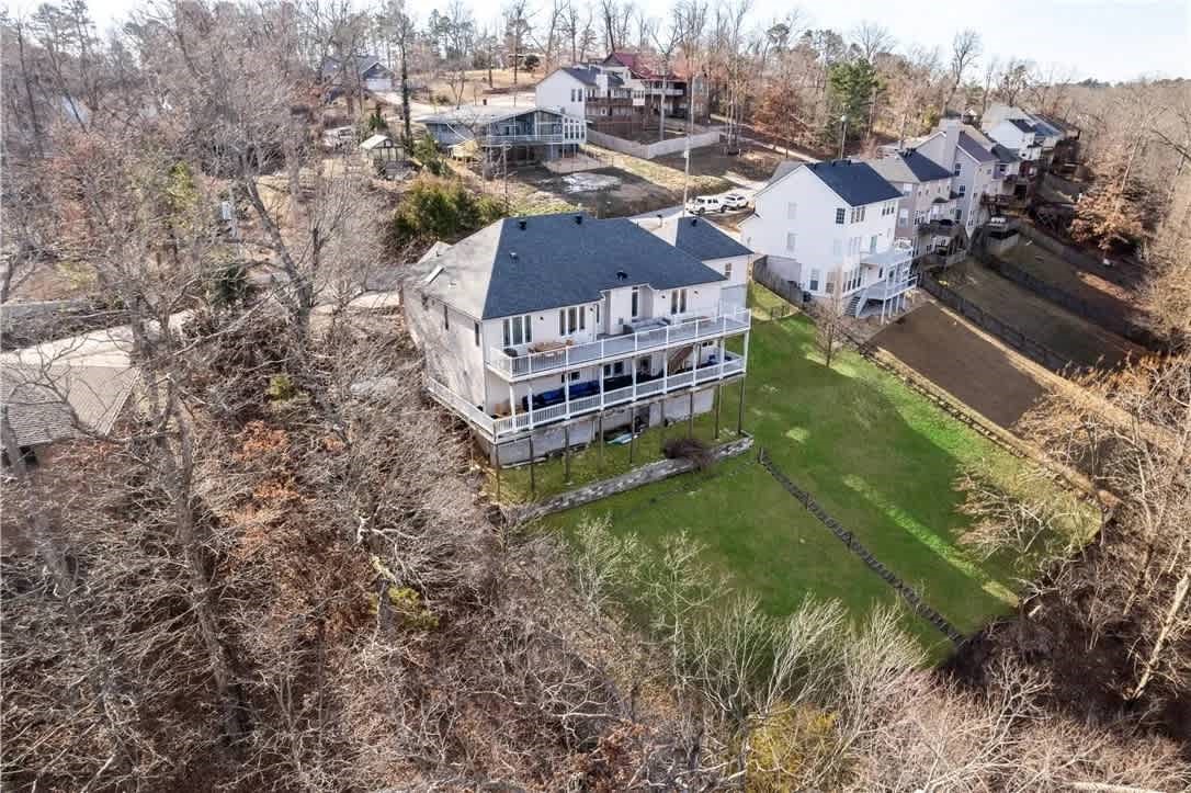 Discover the perfect blend of lakefront living and rental income at this beautifully updated home on Riviera Drive. With 5 bedrooms, 4 baths, two living areas, and two kitchens, the layout is ideal for second living quarters that can be locked off for rental flexibility. Enjoy year-round lake views from the Trex decking and easy access to the community boat dock with private slip for swimming, fishing, and boating.

Recent updates include both HVAC units replaced in 2022 and updated, rerouted ductwork in 2024. Whether for personal use or rental income, this home offers exceptional versatility and a true Beaver Lake lifestyle. 

This property is an established, operating short-term rental with management already in place. The current management company—part of the listing brokerage—has agreed to continue managing the property after the sale at a significantly discounted rate, offering a seamless, turnkey investment opportunity. All furnishings included.