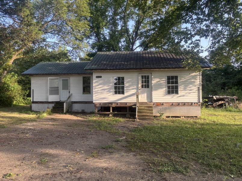 Opportunity awaits with this 2 bed 2 bath home sitting on almost 1/2 acres of land in Plainview. With almost 900 sq ft of living this property is ready for you to come put your personal touch to it. Property is being sold as is.