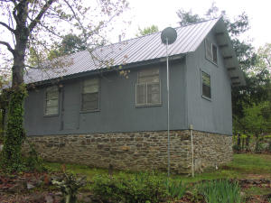 Nice little cozy hide-a-way home with easy access off of Hwy 7. Almost a half acre with some nice landscaping. Home is being remodeled. This would make a nice week-end get-a-way with easy access but is in a private location. County road frontage. Electric and rural water. One bedroom and one bath. Wood burning stove. Small store nearby. Home is in the process of being remodeled. Priced to sell.