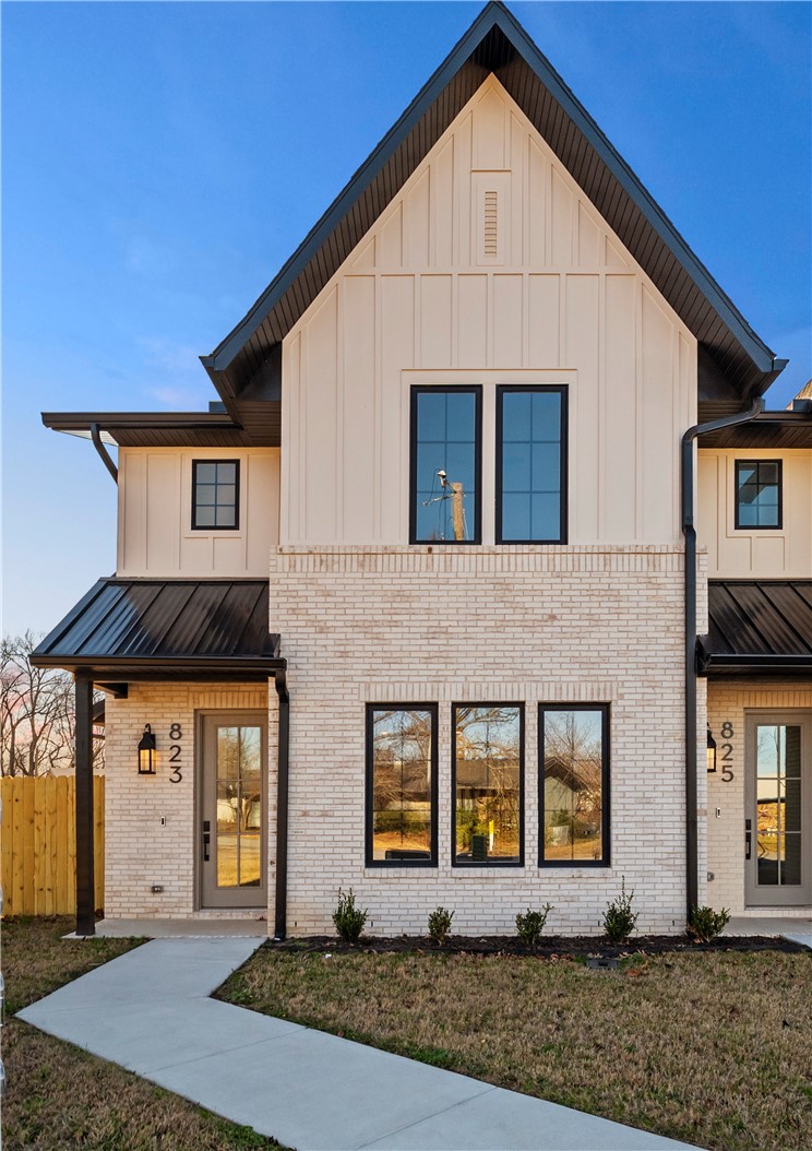 Live in Downtown Bentonville. This design hits the right balance: modern lines, clean finishes, and just enough traditional detail for it to feel warm and inviting. Inside, the ceilings are tall, the windows are oversized, and the main living space is spacious. 
The kitchen is a statement - Café appliances, a real island, ample storage, and plenty of space to cook without bumping into people. Two living areas give you options to lounge on the main level or upstairs. 3 bedrooms, 2 and a half baths, and walk in closets that can handle real life.
The backyard is fenced and private—something that is becoming rare this close to the Square. The garage fits two large vehicles and has 220V outlets on both sides, which means flexibility without future upgrades.
You’re minutes from Downtown, the trails, the restaurants, the energy of Bentonville—while still having space, privacy, and a sense of calm.