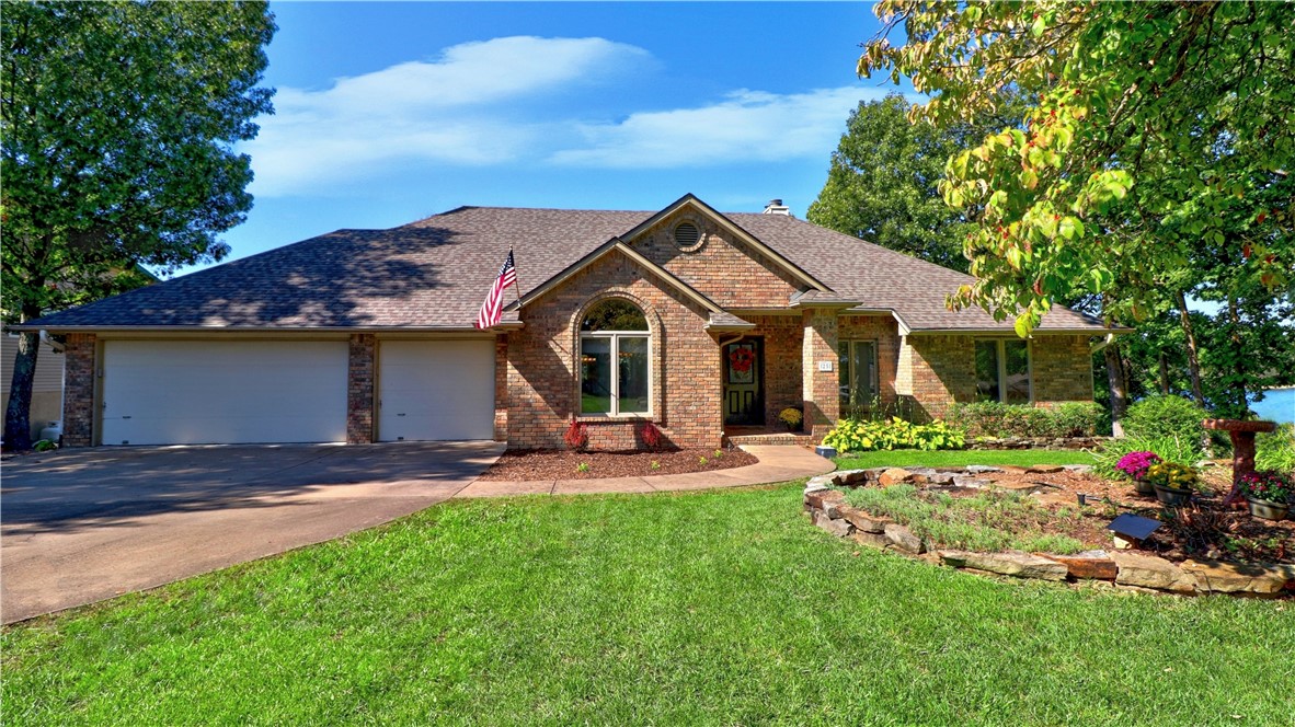 2 MONTHS UNTIL SPRING! LOCH LOMOND LIFESTYLE under $289.00/ HC SF-125 ' LAKEFRONT W/ SEAWALL + 2 LIFT COVERED BOAT HOUSE W/MAIN BODY VIEW. (2018) EZ WALK TO H20! OVER 268 SF SWIM DECK AREA(S), UNCOVERED PATIO AREA X2-384 SF. 0.54 ACRE. 2 LEVELS. REMODELED CHEF KITCHEN (2020)-FULL KITCHEN APPLIANCE PKG(granite/new-newer appliances/kitchen island/coffee station) open to a casual dine area w/ lakefront view. TRUE Formal Dine room. MAIN LEVEL LAUNDRY + Primary Suite w/access to the covered/exposed composite deck. 2 bedrooms, living rm w/access to the covered/exposed composite decking. LL offers second Primary Suite + Ensuite bathroom (2018)+ full size kitchen (2019) w/ breakfast bar/dine area. BONUS RM/GREAT RM/FLEX AREA + SPA/ENCLOSED SUNROOM by Sawyers (2021 w/ lifetime material warranty)-HOT SPRINGS SPA (2021 6-7 pl) to remain. POOL TABLE to remain. GEOTHERMAL:HVAC + H20 TANK:2020 ROOF:2022 Golf cart pathway:2018 HOME WARRANTY 750 gallon septic tank w/freshwater sewer line replaced:2020 improvement list upon request
