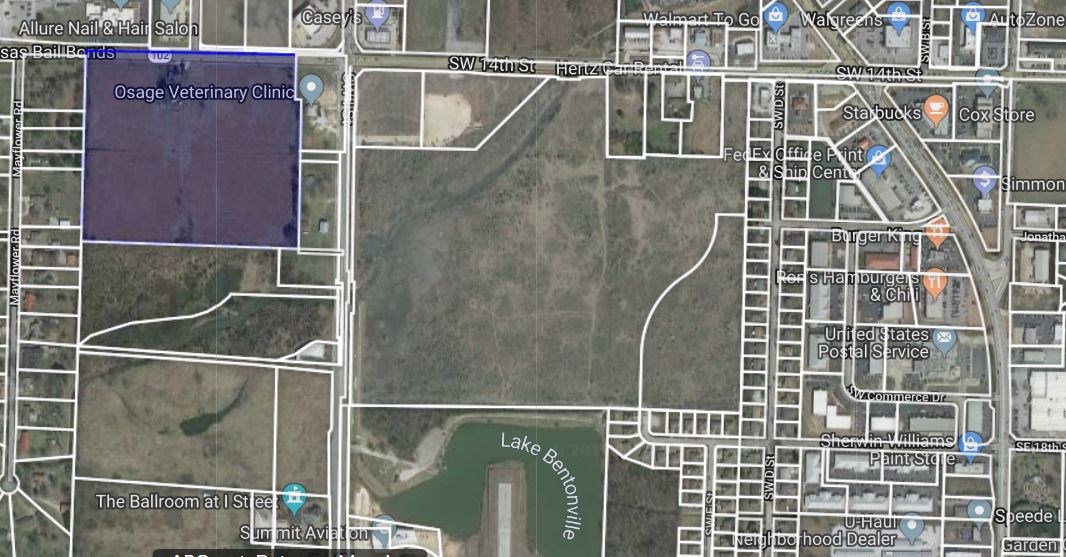 Prime location with major frontage along heavily traveled Hwy 102 West/SW 14th Street near Bentonville Municipal Airport, Climb, & new Bentonville Brewing Company & directly across highway from Aldi. 5 minute drive to downtown Bentonville. 23.43 acres +/- with home, well house, & barn.  City sewer across 102 and sewer hook-up on I Street or Mayflower Road. Commercial or mixed-use development potential. Farmhouse & barn will be sold AS-IS.  Structures are tear down.