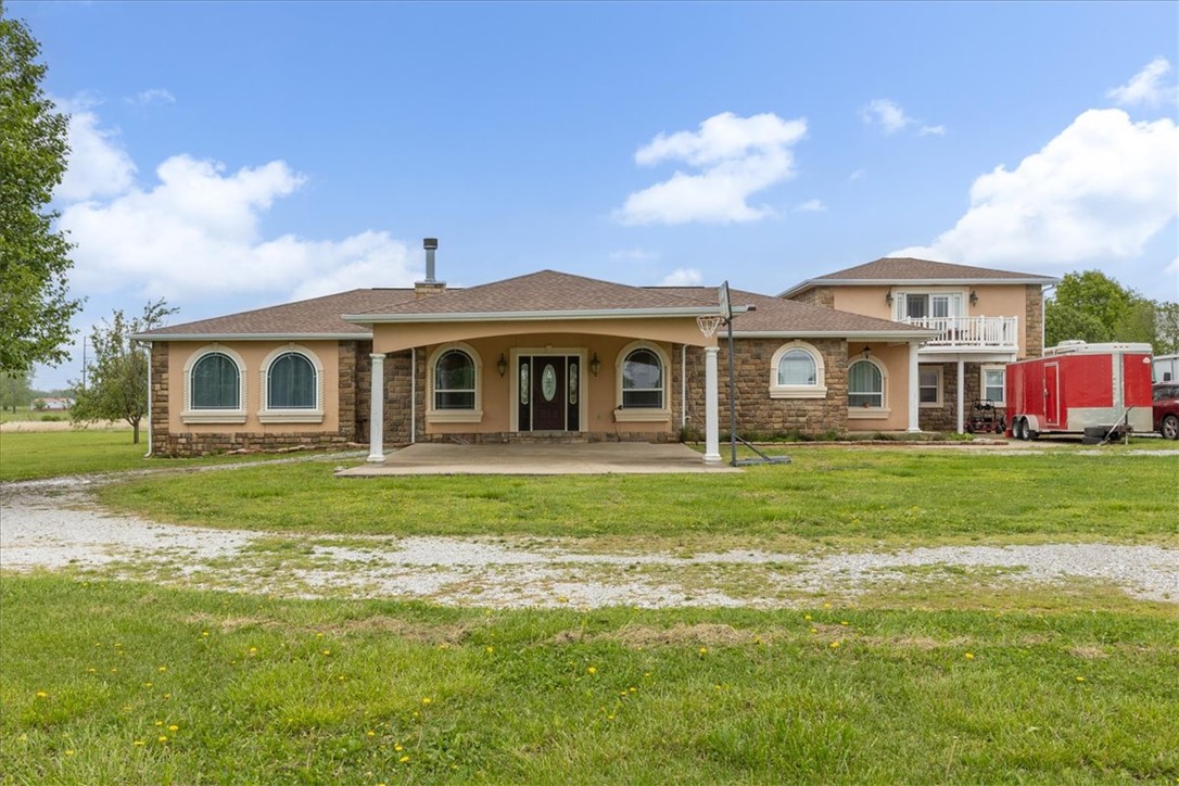 Gorgeous property with lots of possibilities with this custom-built home on 10 +/- level acres ideal for a shop. Mostly one-level living with a 2-level “tower” on east end of home with unique, large bonus room opening to deck with beautiful views. Gourmet kitchen features stainless appliances, ample cabinet storage + pantry, granite countertops, large formal dining area & more. Very livable split plan with 5 bedrooms, 3 full baths. Spectacular walk-in primary shower with custom frameless door, rain head shower & double vanity. Wood burning FP is great focal point for house made for entertaining.