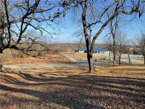 Come check out these beautiful 3 oversized contiguous lots, making up a total of 1.87+/- acres. Lots are multi-use and are zoned for residential and commercial. It is located in town yet has breathing room between the main road and house. Right across the street from a medical facility and close to every amenity you might need including, parks, shopping, hiking trails, and a gym. With work, this would make an excellent home for new couples as a first home or investment property.