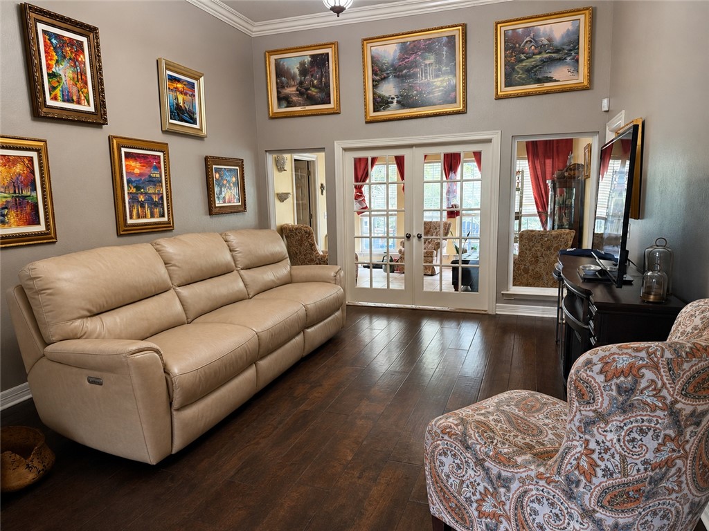 Situated on over 2 acres in Springdale, this 3,250± sq. ft. brick and rock home blends timeless character with functional living. Inside, soaring ceilings and a grand entry welcome you into a spacious layout featuring 3 bedrooms, 2.5 baths, a cozy den with a gas fireplace, a bright sunroom, and an eat-in kitchen with granite countertops, an island, and custom woodwork. Upstairs, the oversized bonus room is ready to fit your lifestyle as a media room, home office, game room, or hobby space. Step outside to enjoy the large deck, new privacy fence, dog kennels, storage building, 3-car garage, extended driveway, and RV parking. Conveniently located with easy access to I-49, shopping, dining, and nearby walking and biking trails.