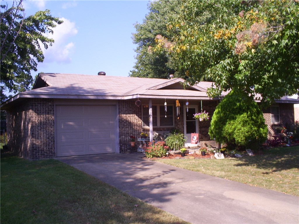 Beautifully updated with tile, paint and more. This 3 bedroom home on a quiet street. Just can't be resisted. 2003 roof, 2004 heat & air units & windows. Good garage storage, large fenced yard in front and in back, covered patio and flower gardens are just a few features of this wonderful home. Don't wait, see it today!