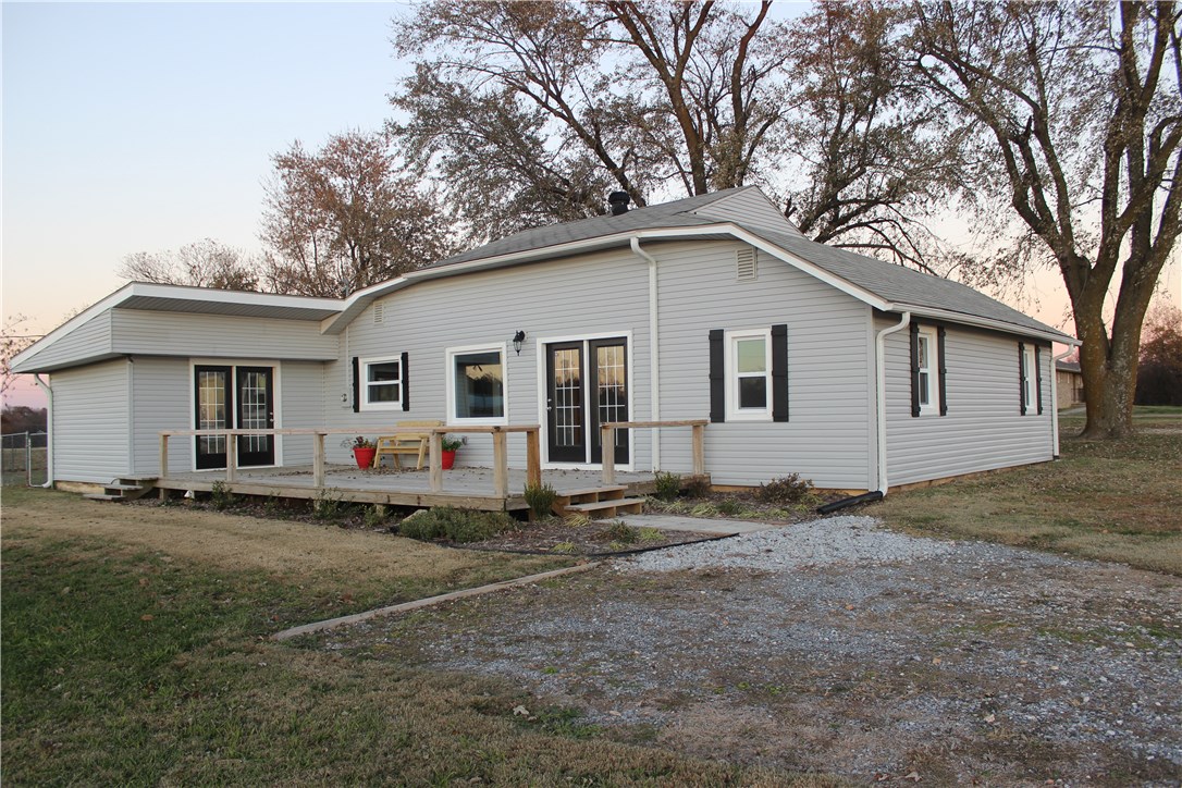 Great new re-model sitting on 3 acres! Granite counter tops, HUGE master closet, new HVAC, water heater, roof, plumbing, 2 and 3/4 baths with fenced back yard, french doors, new E-windows, updated fixtures and stainless steel appliances. 15 min to Walmart Home Office. Property sits less than a half mile from the 72/549 exit. Property is from fence line to fence line in a rectangle shape. Chicken coop is part of property as is foundation for pole barn. New propane tank and lines!