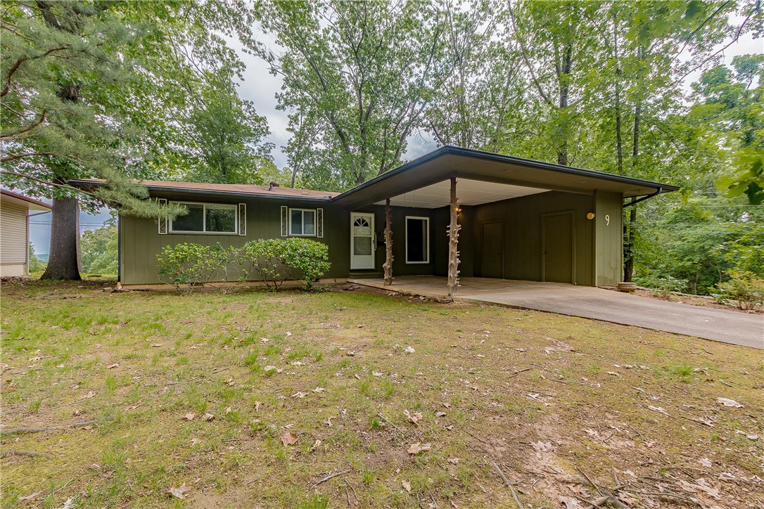 One owner home, beautifully maintained. On a level, corner lot close to the BV Country Club. Bentonville schools. Great starter home, could use some updating, but also move-in ready.  A terrific three season sun porch (not included in the square footage) to enjoy mother nature.  Right next to the 11-Under Bike Trail. This is a must see home that has great value in this price range!