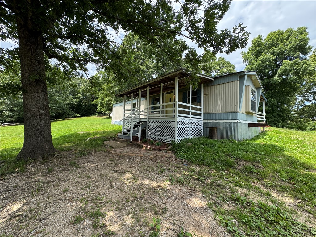Escape to the beautiful Ozarks with this 2-bedroom, 1-bathroom home situated on 3.48 scenic acres in Marble Falls! Nestled in the heart of Newton County, this property offers excellent privacy, mature trees, and gorgeous wooded views. Whether you are looking for an affordable full-time residence, a weekend getaway, or an outdoor enthusiast's basecamp, this acreage has endless potential. The manufactured home features a functional 2-bed, 1-bath layout ready for your personal touches. Enjoy the peace and quiet of country living with plenty of room to garden, expand, or enjoy the local wildlife. Best of all, you are just minutes away from Scenic Highway 7, Jasper, and world-class hiking, floating, and elk-watching along the Buffalo National River.