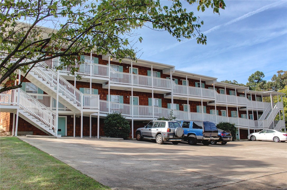 20 unit apartment complex located just blocks from the University of Arkansas with new exterior cedar shingles, new roof, large parking lot, new HVAC, new stoves, new refrigerators, new painted rail system, some of the units have been completely remodeled with all new interiors and continuing to remodel interiors as units become vacant.