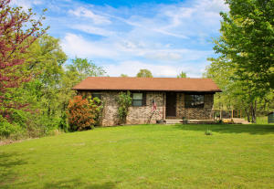COOL VIBES in a super cute all brick home! This house has all you need! GRANITE, yes, granite counter tops, stainless steal apron sink, tons of kitchen storage matching Samsung appliances that convey with the home, even the washer and dryer convey! 3 Bedrooms and 2 Bathrooms, a full basement with tons of possibilities, security system, open living and dining concept with beautiful hard surface floors and a cool modern deck complete with the patio furniture that makes this one feel like a home worthy of entertaining. Newer HVAC! Great location just south of town, large yard and ready for its forever family! Check this one out before its to late!