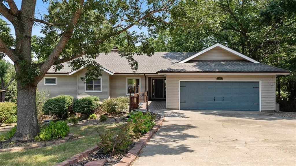Packed with potential, this 3-bed, 3.5-bath Bella Vista ranch style home offers 2,678 sq ft of flexible living space on a beautifully landscaped half-acre lot. With two fireplaces, two living areas, and two decks, there's room to relax, entertain, and spread out. Recent updates include a brand-new roof, new lower-level HVAC, fresh paint, new tile, carpet, lighting, fixtures, and quartz and granite counters throughout. The lower level features two additional spaces — one with outdoor access perfect for a workshop, gym, art studio, game room, or 4th bedroom. The smaller bonus room would make a lovely office or theater room. A two-car garage and finished basement, round out this incredibly versatile home. Community amenities include a clubhouse, tennis courts, and playground, all just minutes from Loch Lomond marina, the K-9 park, and Scottsdale Golf Course. Come see everything this home has to offer!