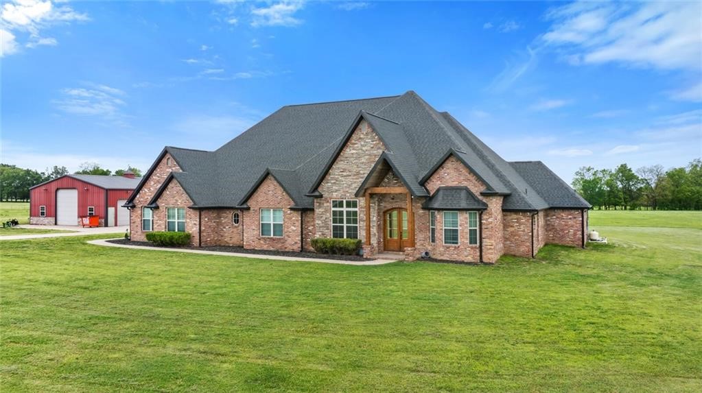 Discover this exquisite 4,610 sq. ft., 4-bedroom, 4.5-bathroom estate home set on 20 lush acres. This two-story gem offers a perfect blend of luxury and functionality. The expansive open entertainment area features a projection screen and a massive game room, ideal for hosting gatherings. The open kitchen, with granite and hardwood, seamlessly flows into the living room, complete with a cozy gas fireplace, creating a warm and inviting atmosphere. Step outside to the covered porch and entertainment area, where you'll find an in-ground saltwater pool, perfect for relaxation and outdoor fun. The master suite is a true retreat, boasting an oversized walk-in, dual entrance closet, and an open floor plan master bath designed for ultimate comfort. The property is adorned with lush grass, providing a serene and picturesque setting. Additionally, a large 60 x 40 insulated shop with electric and three overhead doors offers ample space for projects and storage. This gorgeous estate offers a unique blend of elegance.