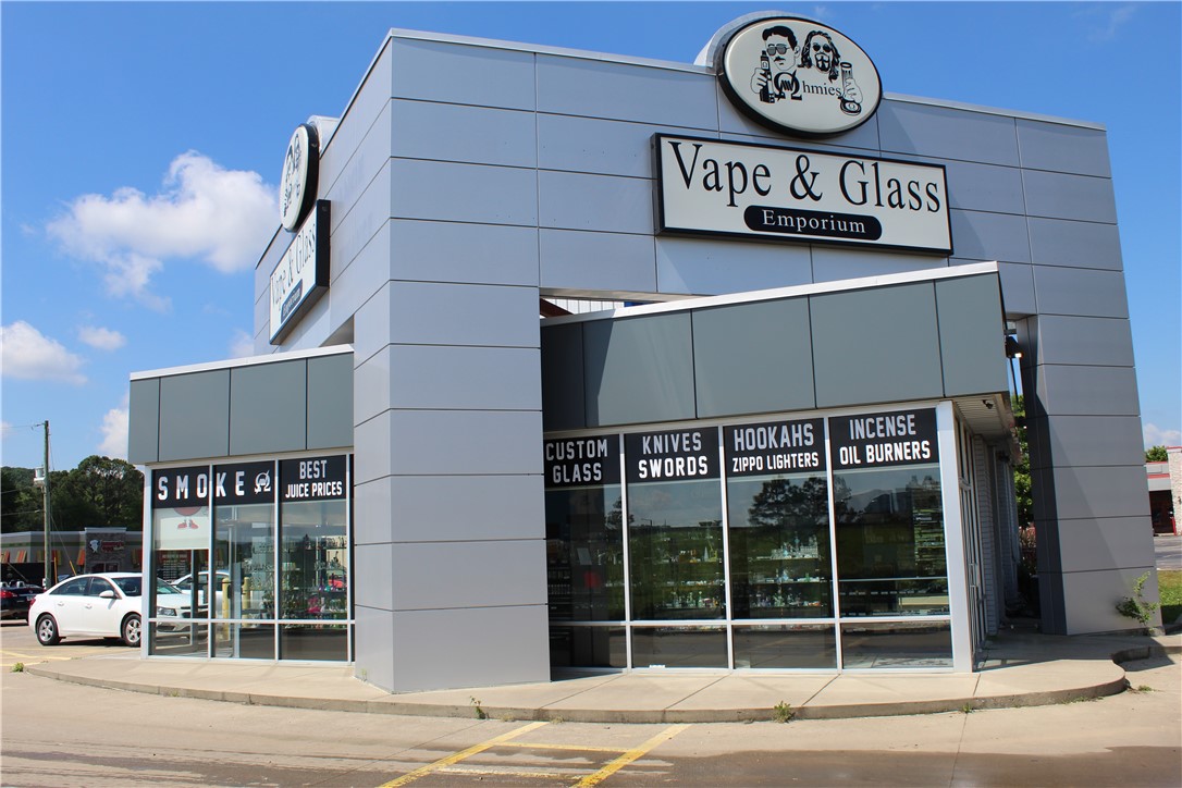 Desirable location near all of Fayetteville's top amenities! Prime location on the corner of I-49 exit 62 and Martin Luther King Jr. Blvd. Retail building features unique design with major signage. Close proximity to University of Arkansas, Baum-Walker Stadium, Fayetteville Historic Square, and Farmington. Open retail space with ample parking. High visibility. Central location.