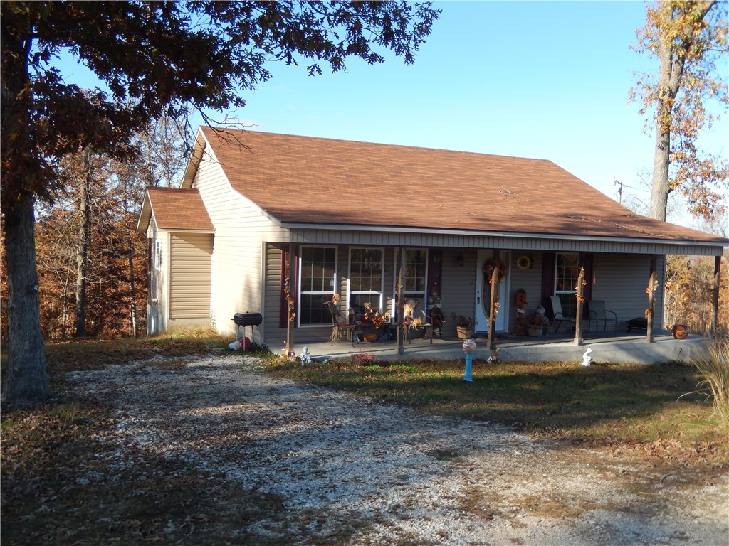 A must see! Great Beaver Lake area home with acreage. Lovely, private location. Only a short drive to town through beautiful "Walnut Valley". There is lake access right off the road just past the driveway. You can be on the water in no time! This cute country style ranch home has a great floorplan, shows like new, includes a home warranty and is easy to show. Priced right to sell!