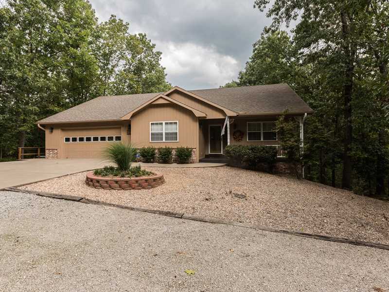 Move in ready! No carpet all hardwood, tile & laminate. Main Level is 3 BDRM, 2.5 baths plus 16 x 12 sunroom (not included in S.F.) & 2 large decks. Fabulous working kitchen w/island, eating bar & pantry. Tall windows & cathedral ceilings in L.R. Basement,level includes family room, bath & Lg heated & cooled workshop (not included in S.F.) Only 1 wall needed to make another bedroom (approx 12 x 16) Property is on 2 lots, but no structure on 2nd lot so could be split. 2 BR septic.