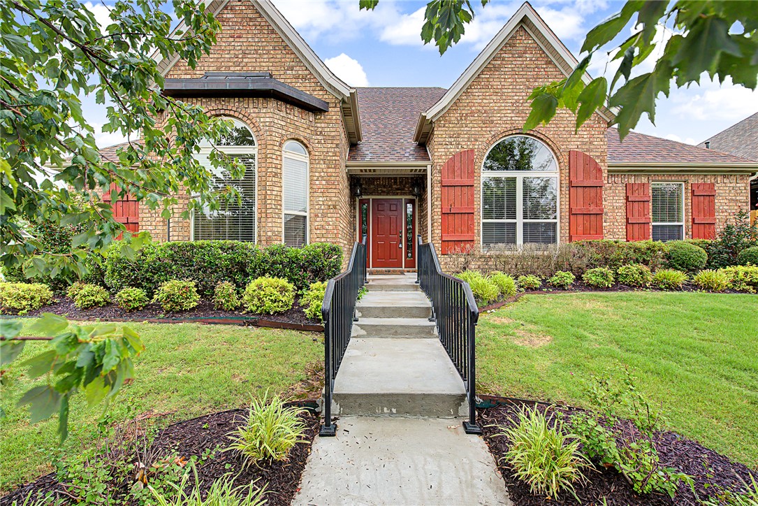 Located in desirable Har-Ber Meadows, this beautiful home offers exceptional design, quality finishes, and amenities including lakes, parks, pool, and clubhouse. The split floor plan features hardwood flooring, crown molding, and thoughtfully designed living spaces. The gourmet eat-in kitchen has granite countertops, stainless steel appliances, pantry storage, and an inviting bar area ideal for gathering and entertaining. The adjacent living and dining spaces provide an elegant yet comfortable atmosphere. The spacious primary suite features a tray ceiling with crown molding, French doors leading to a private patio equipped with 220V for hot tub, a jetted tub, double vanity, walk-in shower, and generous closet space. Additional highlights include a side-load 3-car garage, central vacuum, whole-house speakers, surround sound, sprinkler system, and custom built-in bookcases with a rolling ladder in the front bedroom. New roof 2025. A rare opportunity to enjoy upscale living in one of the most sought-after communities.