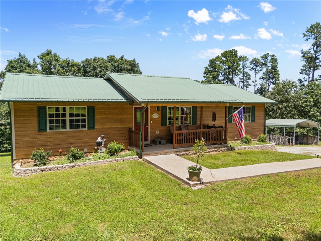 Beautifully maintained 4-bedroom, 3-bath home on 5.95 acres offering the perfect blend of open yard and mature trees. This move-in ready property has been exceptionally cared for and features a finished basement that provides additional living space for a family room, game room, office, or guests. The attached 2-car garage is heated and cooled, making it ideal for year-round use, and the property also includes a storm shelter for added peace of mind. Enjoy the peace and privacy of country living while still being conveniently located just 20 minutes from Harrison, AR, and 20 minutes from Branson, MO, giving you easy access to shopping, dining, entertainment, and everyday amenities. Whether you're looking for a full-time residence or a peaceful Ozarks retreat, this property offers space, comfort, and a beautiful setting ready for you to c
